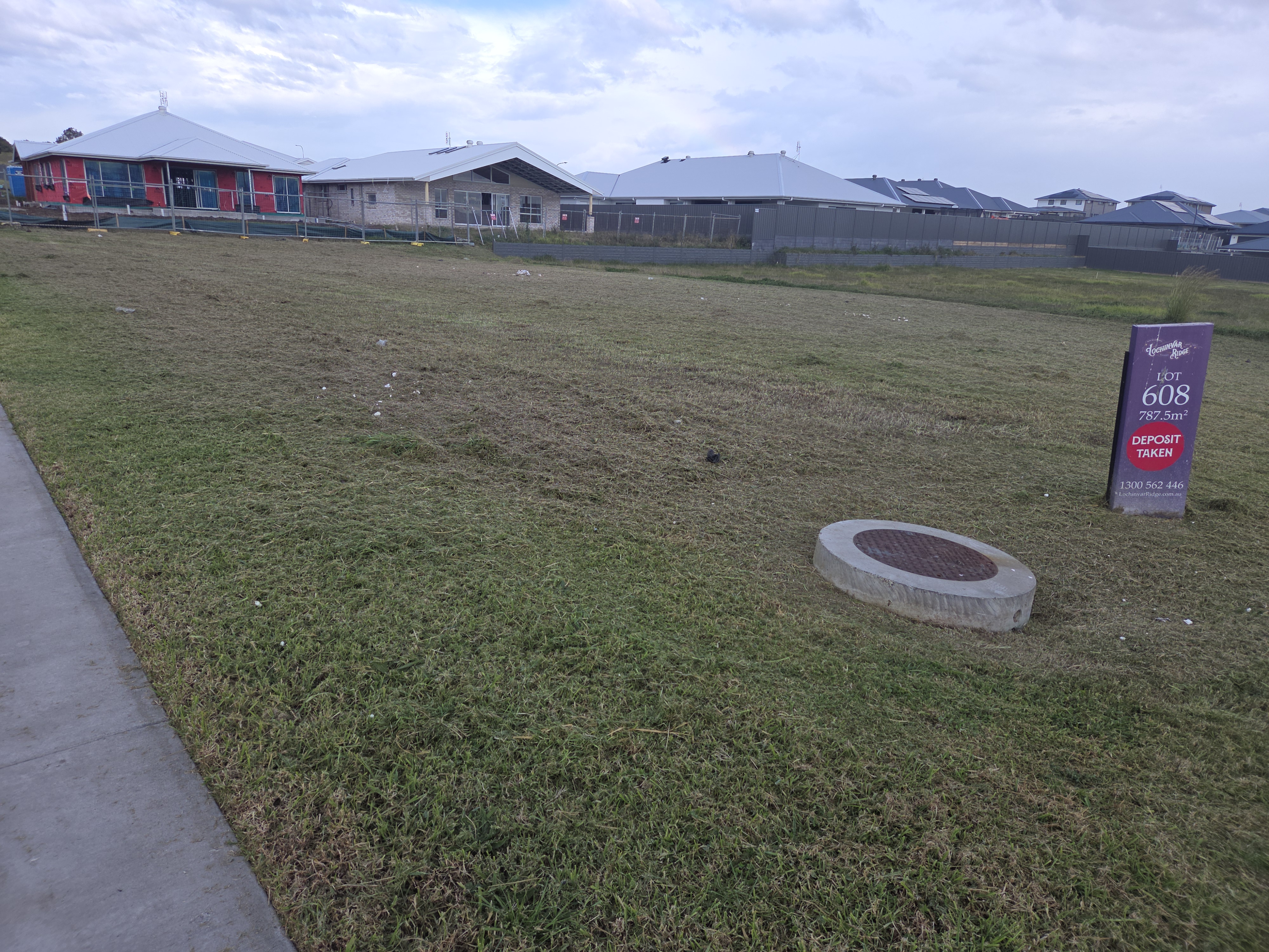 Freshly mowed vacant lot in a new Australian housing estate